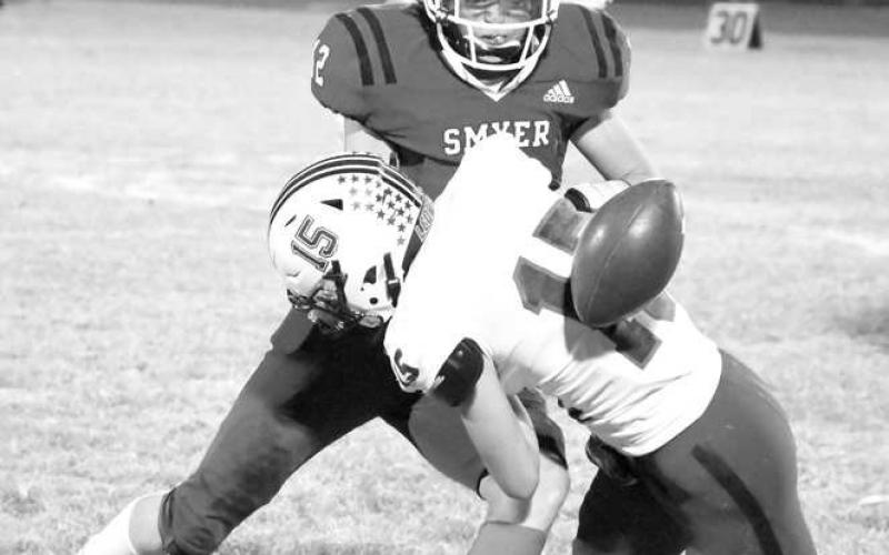 CATCH ATTEMPT- Smyer Bobcats Drew Overstreet had his catch attempt broken up by a New Home defender last Friday. The Bobcats fell to New Home and will look to bounce back in district on the road in Morton Friday. Kickoff is set for 7 p.m. (Staff Photo by Dom Puente)