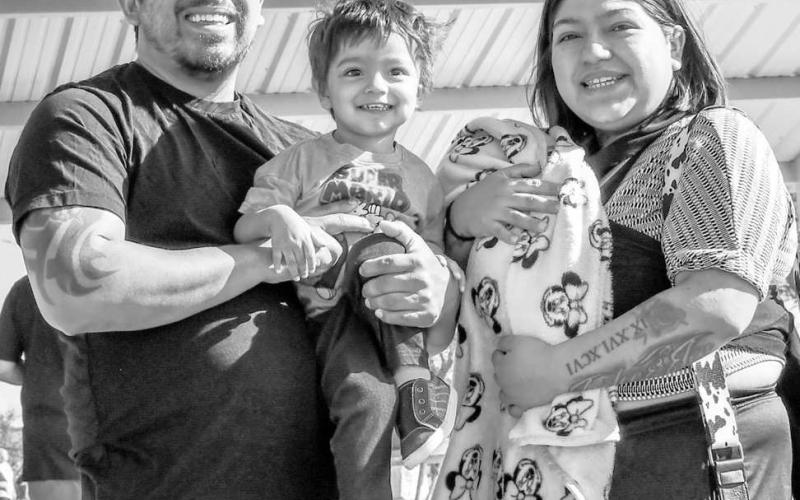 HOPPING DOWN THE BUNNY TRAIL - The Reyna family spent their past Saturday morning at the City Park near Pavillion One searching for Easter eggs during the City of Levelland Parks Department annual Easter Egg Hunt. (Staff photo by Hannah Woodrum)