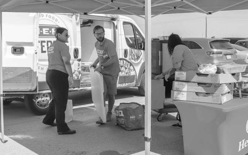 LUNCH PROVIDED - H-E-B Provided BBQ sandwiches at the South Plains Food Bank distribution event on Wednesday at the Lobo Stadium. (Staff photo provided by Emily Campos)