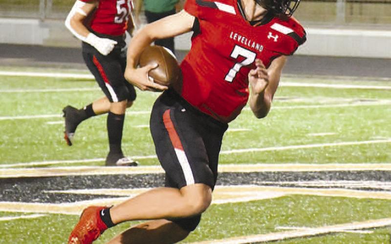 QB SCRAMBLE- Facing off against the Monahans Loboes in the 4A-2 Bi-District round, the Levelland Lobos fell short of extending their season as they lost, 27-15, Thursday in Andrews. Lobo QB Konner Alexander scrambled outside the pocket for a big gain. (Staff Photo by Dom Puente)