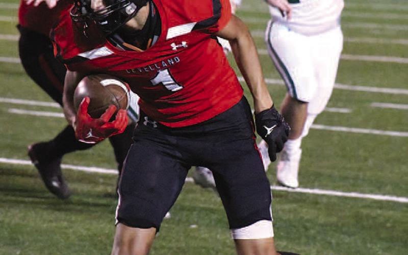 RUNNING ROOM- Facing off against the Monahans Loboes in the 4A-2 Bi-District round, the Levelland Lobos fell short of extending their season as they lost, 27-15, Thursday in Andrews. Lobo Zameron Lecroy looked for space and running room during the game. (Staff Photo by Dom Puente)