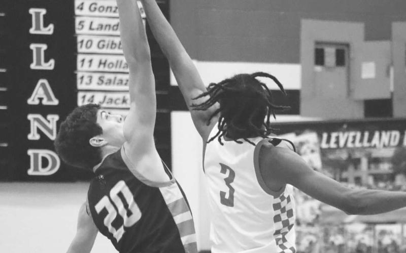 TIP OFF - Levelland Lobo Eryk Jones gave the Lobos the first possession of the game against the Jayton Jaybirds this past Tuesday. The Lobos fell to the ranked Jaybirds 56-44. (Staff photo by Aalijah Soliz)