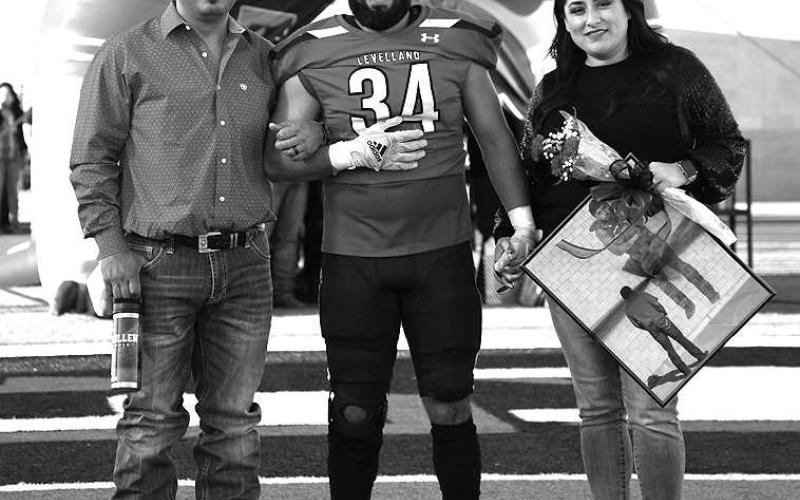 SENIORLOBO- Levelland seniors were recognized last Friday during the Lobos home win game against Borger. Lobo Marco Guillen was escorted by his parents Mark and Elizabeth Guillen. (Staff Photo by Dom Puente)