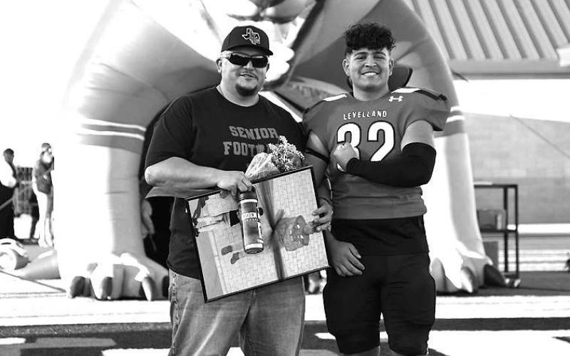 SENIOR LOBO- Levelland seniors were recognized last Friday during the Lobos home win game against Borger. Lobo Aiden Herrera was escorted by his father Adrian Herrera. (Staff Photo by Dom Puente)