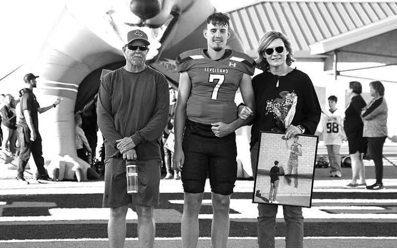 SENIORLOBO- Levelland seniors were recognized last Friday during the Lobos home win game against Borger. Lobo Konner Alexander was escorted by his parents Rick and Pam Alexander. (Staff Photo by Dom Puente)