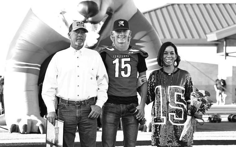 SENIORLOBO- Levelland seniors were recognized last Friday during the Lobos home win game against Borger. Lobo Wyatt Baccus was escorted by his parents Brent and Donne Baccus. (Staff Photo by Dom Puente)