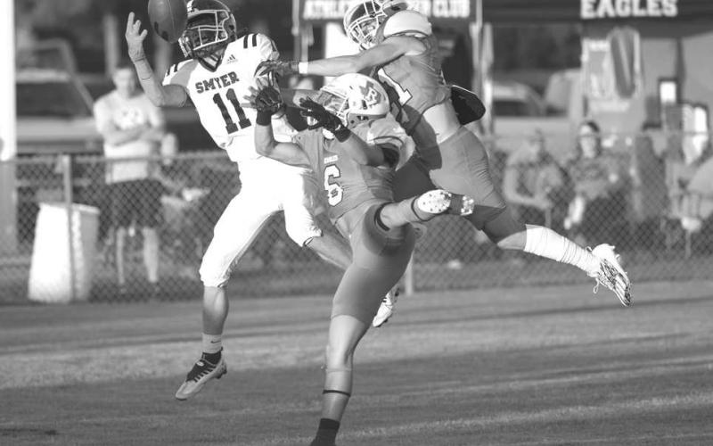 GREAT CATCH - Smyer wide receiver made the great catch in double coverage during the teams district opener against the Ropes Eagles. (Photo courtesy of Donovan Martin)