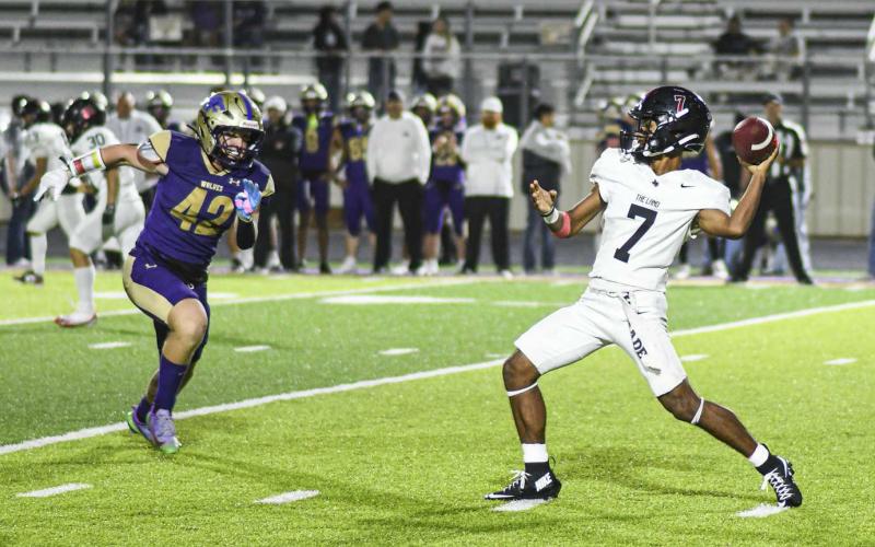 BALLIN’ BRYSON – Sophomore quarterback Bryson Golightly makes the throw during a football game against Dalhart this past Friday night at Memorial Stadium. Golightly would end with two passing touchdowns on the night. (Staff photo by Jentezen Smith)