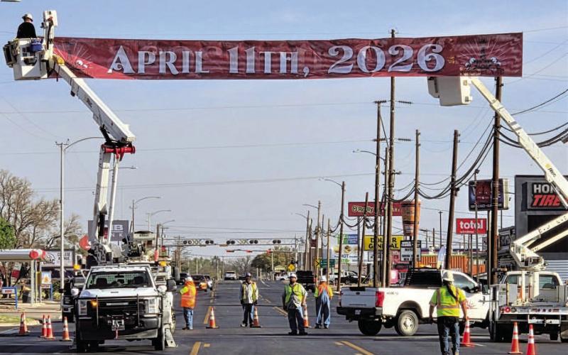 Crews from the City of Levelland Public Works, TxDOT and Xcel Energy installed the Centennial banner on College Ave. near the intersection of Hwy 114 and Hwy 385 to alert people to the upcoming celebration on April 11. (Staff photo)
