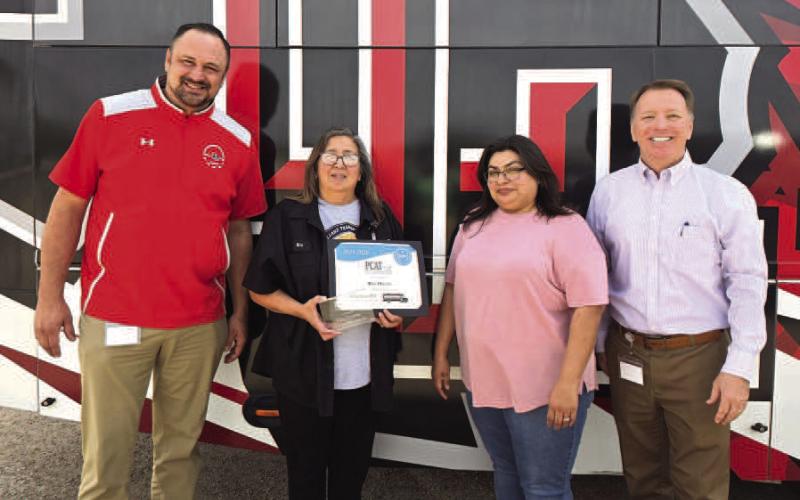 TEXAS BUS DRIVER OFTHE YEAR-- Rita Huerta was honored by the Property Casualty Alliance of Texas as the Texas Bus Driver of the Year. The award was presented by LISD Assistant Superintendent Rodney Caddell in recognition of the many qualities that make Huerta exceptional, including her leadership, positive attitude, perseverance, strong relationships with students and parents, and outstanding technical skills. (Levelland ISD photo)