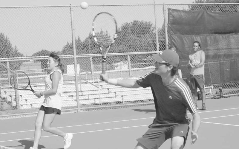 DOUBLES - Levelland athletes Martin Nieland and Jasmin Mendoza were practicing together during Levelland tennis two-a-days. (Staff Photo by Aalijah Soliz)