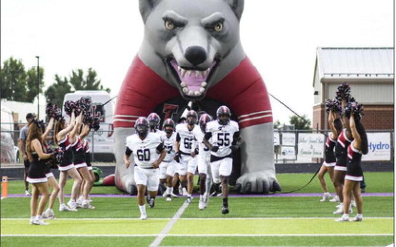 HERE COMES THE LOBOS – The Levelland Lobos football team make their entrance onto the field at Memorial Stadium for their matchup against Dalhart this past Friday night. The Lobos would end up falling short, 55-15. (Staff photo by Jentezen Smith)