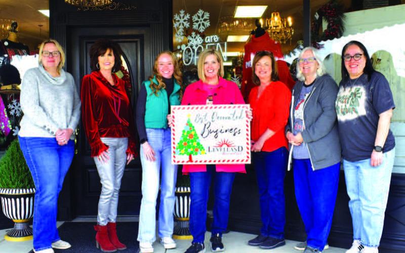 Levellands’ Studio- K was selected as the winner of keep Levelland Beautiful annual Best Decorated Business of the month contest for the 2023 holiday season. Pictured from left to right are: Kelly Hancock, Cristal Isaacks, Owner Chole Carpenter, Kenna Trotter, Tammy Franklin, Donna Wheeler and Janie Morales. Awards were presented this past week before Christmas. (Staff photo by Emily Campos)