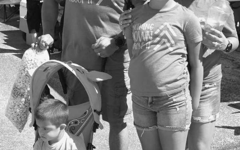 FAMILYOUTING – Jamie and Junior Zapata brought their children Jasylyn and Jaxton to enjoy the events at the Cotton &amp;amp; Crude Festival. The Zapata family also participated in the parade portion of the festival. (Staff Photo by Dominick Puente)