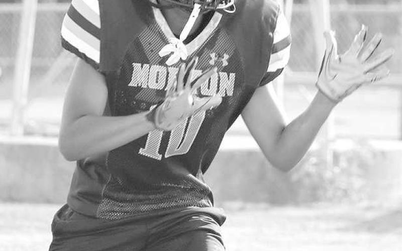 CONCENTRATION - Morton wide receiver Xavien Rodriguez was focused on the ball going his way during team drills in the evening practies of two-a-days. (Staff photo by Aalijah Soliz)