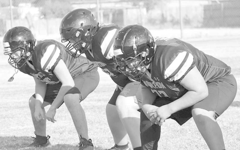 BIG DOGS - The Morton Indians offensive line was putting in work during the evening pracitces during two-a-days to get their footwork and hand placement right. Pictured above is Abel Vizcarra, Britton Boggs, and Luis Yanez. (Staff photo by Aalijah Soliz)
