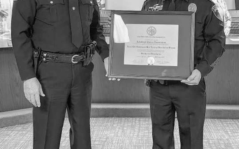 HARD WORK RECOGNIZED - The Levelland Police Department received their Texas Police Chief’s Association Law Enforcement Accreditation Program Certificate during Monday’s Levelland City Council meeting. Pictured are Amarillo Police Chief and Region Two TPCA Director Martin Birkenfield and Levelland Police Chief Albert Garcia holding the TPCA Certification. (Staff photo by Dom Puente)