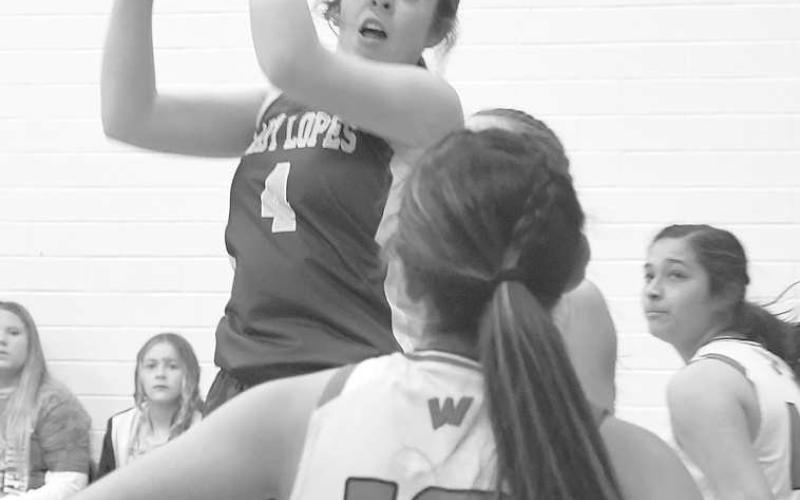 STRONG REBOUND- Whiteface’s Emma Ayers grabbed a rebound in a 63-15 road win over the Whitharral Lady Panthers last Friday in high school girls’ basketball action. Ayers had 10 points and eight rebounds in the effort. (Photo Courtesy of Jay Kelley)