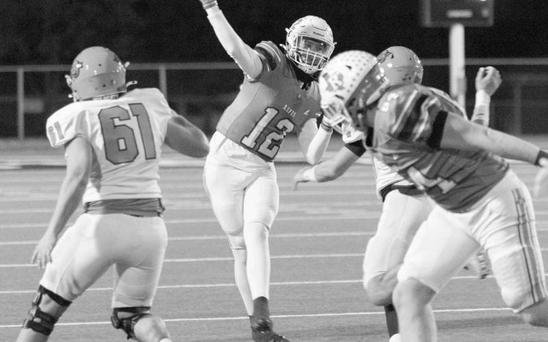 RUNNING WILD - Ropes Eagle Kade Franklin ran outside of the pocket to deliver the pass to a receiver downfield this past Friday in Big Spring. (Photo courtesy of Donovan Martin)