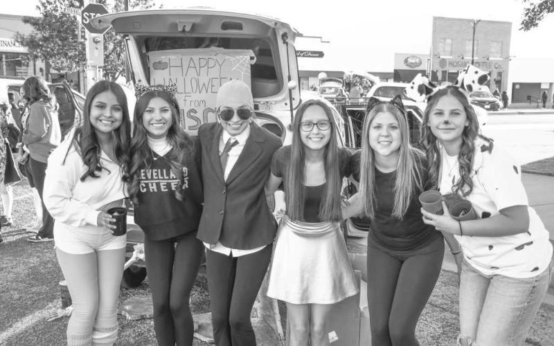 LHS COSTUMES – LHS Cheer smiled in their costumes outside of their trunk or treat car set up on Avenue G during Thursday’s Halloween event in downtown Levelland. (Staff photo by Evin Thomas)