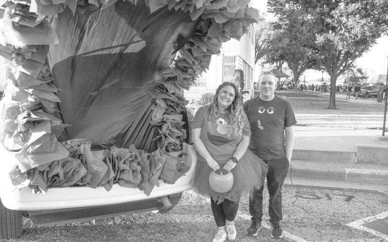CORNHOLE – Rebecca Ulm and Travis had candy and cornhole at their Hickory Terrace van for trunk or treaters during downtown Levelland’s Trunk or Treat event on Thursday. (Staff photo by Evin Thomas)