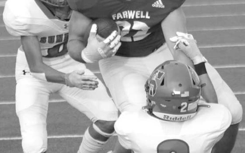 SECURE TACKLE- The Sundown Roughnecks traveled to Acuff to face the 3A Roosevelt Eagles on Friday night and left with a three point loss 26-29. Jayson Martinez secures as a tackle as Jaryn Flores comes in to help finish the play. (Photo Courtesy of Chris Bratcher)
