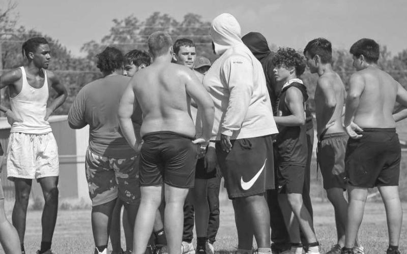 OFFENSE HUDDLE - The Levelland offense got in their huddle around Levelland Coach Keith Dixon this past Thursday morning to get a break during team drills at the Levelland High School. (Staff photo by Aalijah Soliz)