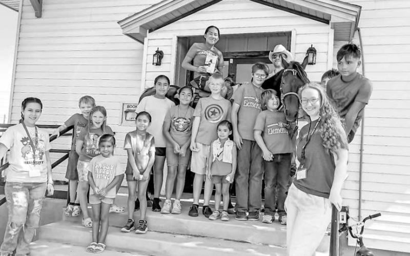 WRITERS’ WEEK - During the City of Sundown’s Summer Library Program, a highlight was local author S.J. Dahlstrom and his horse, Thunder, visiting during Writers’ Week. Children received tips on writing, reading, and horsemanship. (Photo courtesy of City of Sundown Library)