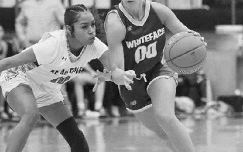 FOCUSED - Whiteface Lady Lope Lainey Sanders drove past her defender during the team’s district game against Seagraves this past Tuesday night. (Photo courtesy of Holly Crutcher)
