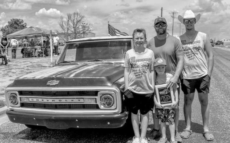 KING OF THE HILL – Pictured is Brent West and his family after he and his truck won the burn out competition at Thunder On the Plains on Saturday at the Levelland City Park. (Staff Photo by Ada Niederhauser)