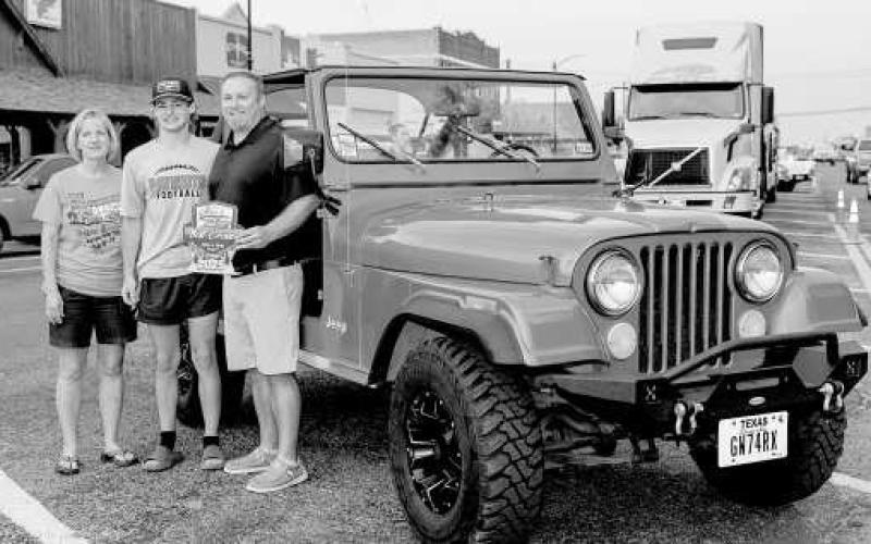 CRUISE WINNER - Pictured is Brody Mowery and Zack Mowery with Lindy Williams after receiving an award during the Thunder on the Plains Cruise. (Photo courtesy of J. Conrad Photography)