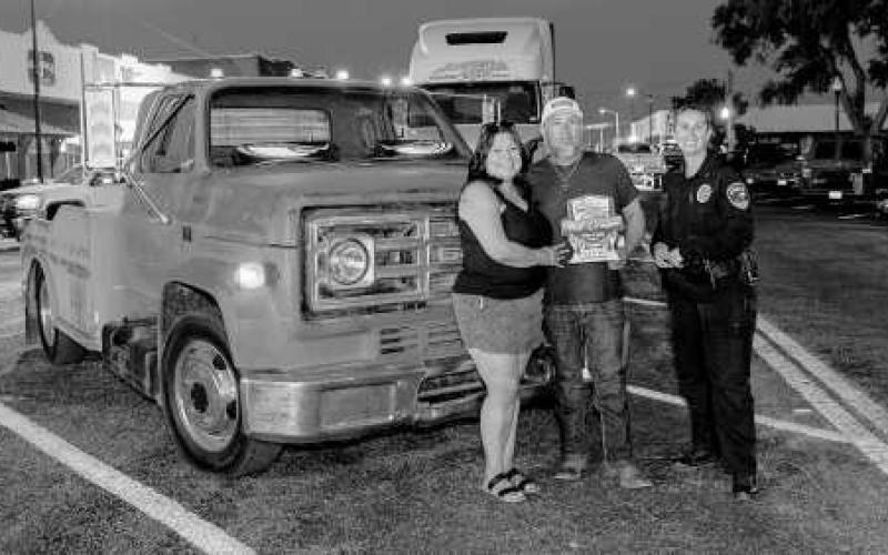 CRUISE WINNER - Pictured is Steven and Maria Hernandez with LPD Chief Erica O’Bryon after receiving an award during the Thunder on the Plains Cruise. (Photo courtesy of J. Conrad Photography)