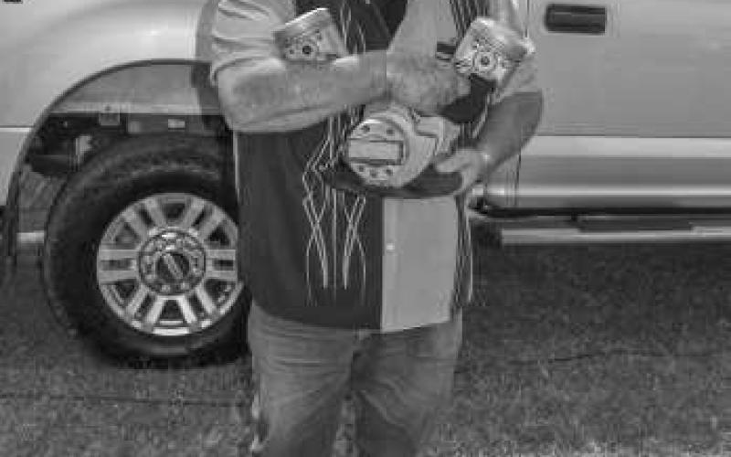 BEST MOTOR – Pictured is Shane Ferguson with his award for Best Motor at the Thunder On the Plains Car Show on Saturday at the Levelland City Park. (Staff photo by Ada Niederhauser)