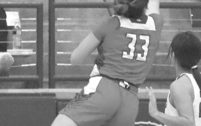 ACROBAT - Sundown Roughette Allie McCormick made a great layup with the ball during the teams loss against the Portales Lady Rams for the teams first game of the Littlefield Tournament. (Staff photo by Aalijah Soliz)