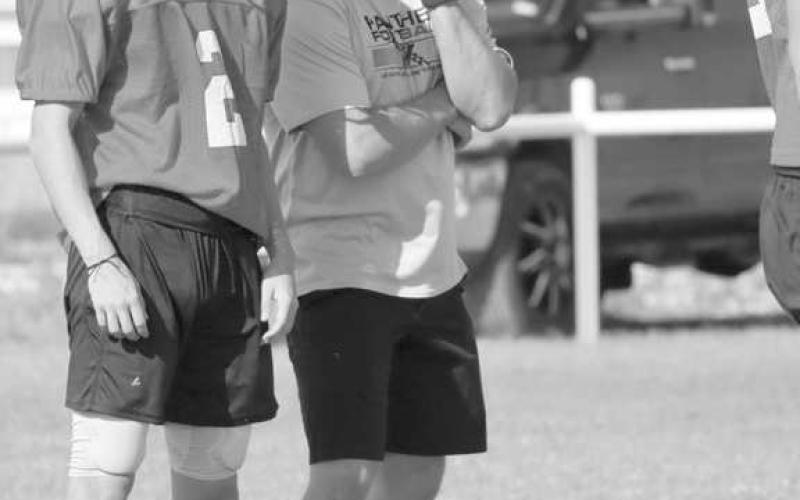 LISTEN - Head Football Coach Jeremy Holt went over the drills with his athlete Landon Lee during Whitharral two-a-days training. (Staff photo by Aalijah Soliz)