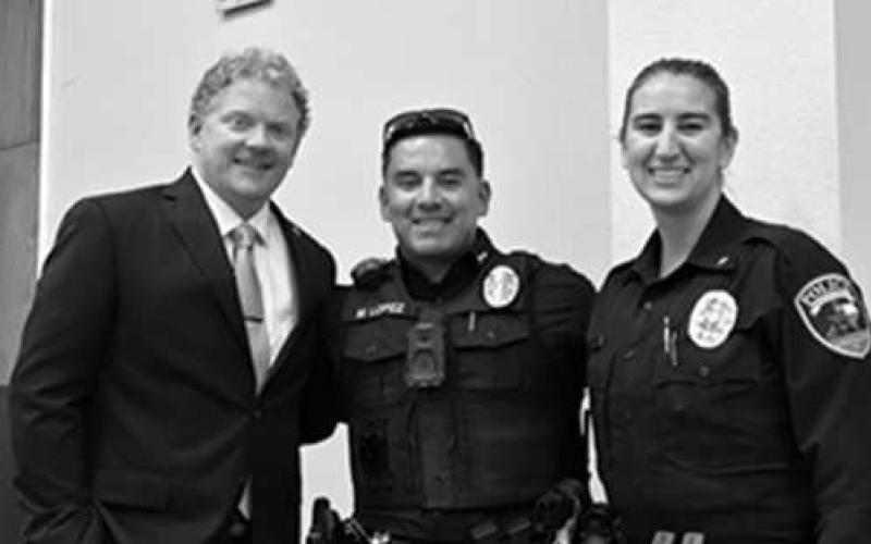 NEW BEGINNINGS - Pictured left to right Dr. Matthew Birdwell, police officer Lopez and Chief O’Byron, accepted the $10,800 grant to provide the LPD new Optics. (Photo courtesy of LPD)