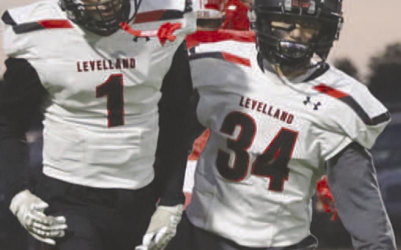 TOUCHDOWN - Levelland Lobos Ben Alvarado and Ricky Rodriguez jogged off the field after they scored the first touchdown of the game from a long pass. The Lobos will play against West Plains this Friday at home at 7 p.m. (Staff photo by Aalijah Soliz)