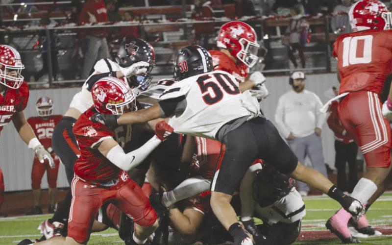 TRENCHES - The Lobo defense did their best to contain the Ranger offense all night in their road loss. Pictured above is the defense stopping a Ranger run play at the line of scrimmage for a limited gain of yards. (Staff photo by Aalijah Soliz)
