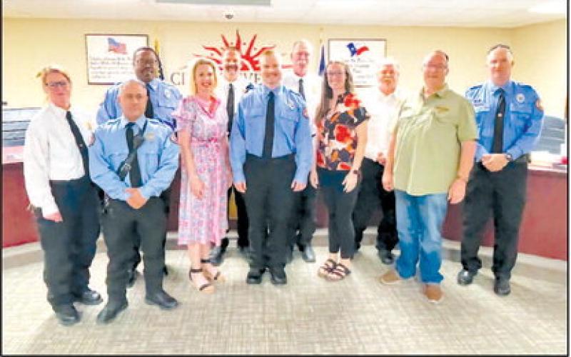 WELCOME TO THE LFD- During the April 28 City Council meeting, Cade Millenbine (Center) underwent an Oath of Office and a pinning ceremony to join the Levelland Fire Department (LFD). Following the pinning ceremony, family, LFD personnel and Council posed for photos with Millenbine. (Staff photo by Dom Puente)