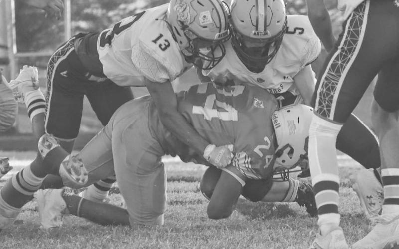 RALLY - Anton Bulldogs Adrian Castillo and Lano Castillo wrapped up the Eagle ballcarrier last Friday night during their game in Motley County. (Staff photo by Aalijah Soliz)