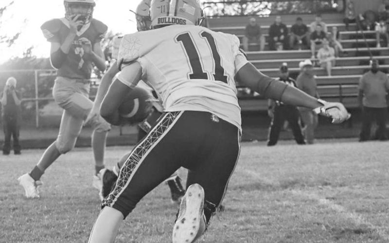 HOUSE CALL - Anton Bulldog Jose Avalos caught the ball in the flat last Friday night during the team’s game against Chillicothe in Motley County. (Staff photo by Aalijah Soliz)