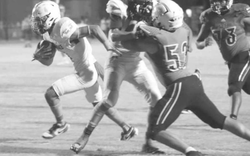 OPEN FIELD - Jeremiah Rendon got a good block from Isaak Soliz in a 60-12 Whiteface Antelope win over the Springlake-Earth Wolverines last Friday in UIL six-man high school football action. The Antelopes host Wellman-Union on Oct. 18 to start district play. (Photo by Holly Crutcher)