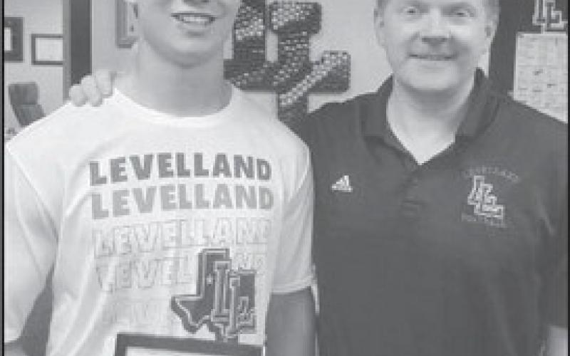 SCHOLARSHIP PROGRAM - Levelland ISD High School Principal Mathew Birdwell announced LHS senior Austin Ellis has been named Commended Student in the 2024 National Merit Scholarship Corporation. Pictured is Mr. Birdwell presenting Ellis with the award.(Photo submitted by Cristal Isaacks)