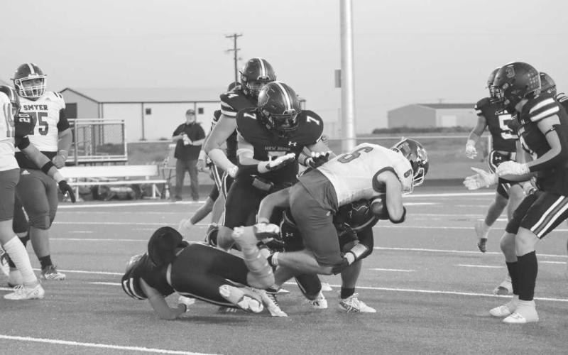 TRUCK - Smyer wide receiver had a good run against the Leapord defense trucking over one player to get some much needed yards. (Staff photo by Aalijah Soliz)