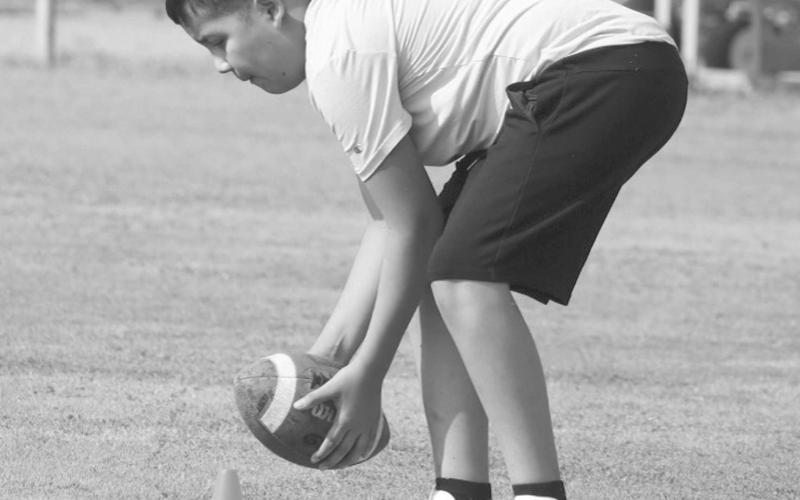 ATHLETIC CATCH - A Morton student made the tough catch at his feet last Thursday morning at the Morton Football Camp. The camp lasted from Thursday to Friday in the morning to keep the kids active during the summer. (Staff photo by Aalijah Soliz)