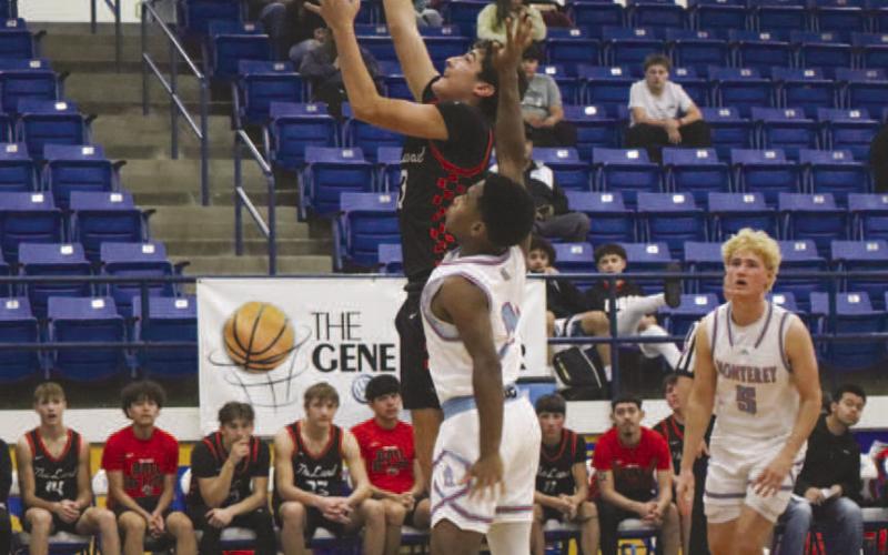 EASY BUCKET - Levelland Lobo Ethan Salazar layed the ball up on the team’s fastbreak against the Monterey Plainsmen in Frenship. (Staff photo by Aalijah Soliz)