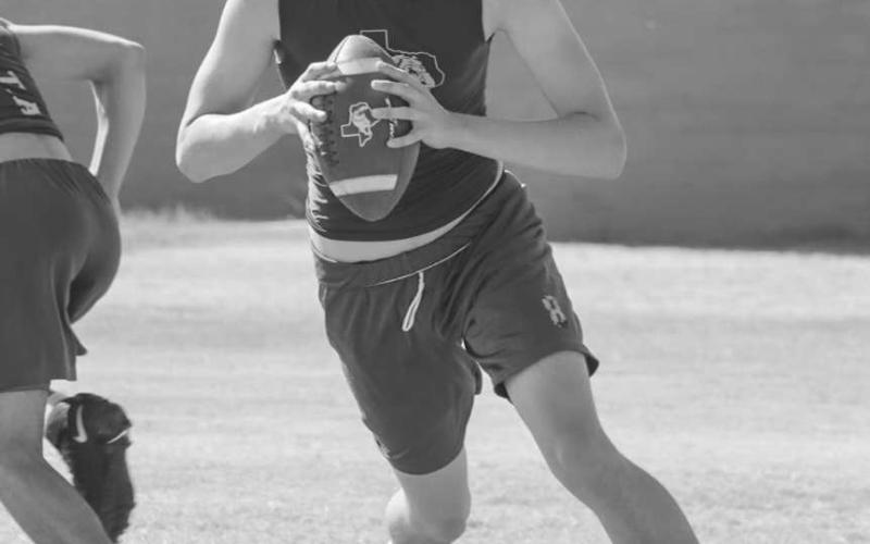 MOBILE - Anton Bulldog Caleb Carlock threw the ball on the run this past Monday during team drills for the first day of two-a-days. (Staff photo by Aalijah Soliz)