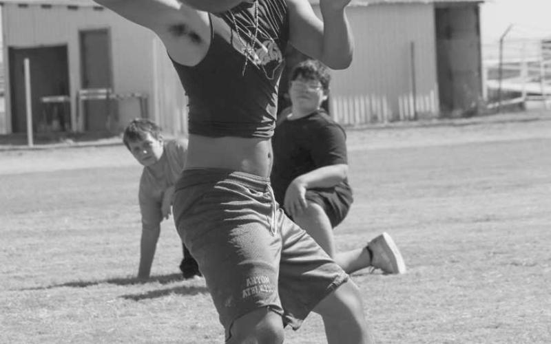 FAST BALL - Anton Bulldog Gavin Martinez threw a dart over the middle of the field to hit his receiver in stride this past Monday during two-a-day practices. (Staff photo by Aalijah Soliz)