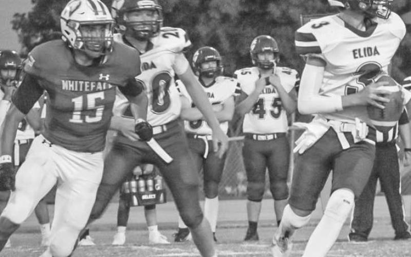 HOT PURSUIT - Whiteface Antelope Auscar Gandara was in pursuit of the Elida quarterback this past Friday during the team’s homecoming game. Whiteface mercy-ruled the Tigers 48-0, at halftime of the game. (Staff photo by Aalijah Soliz)