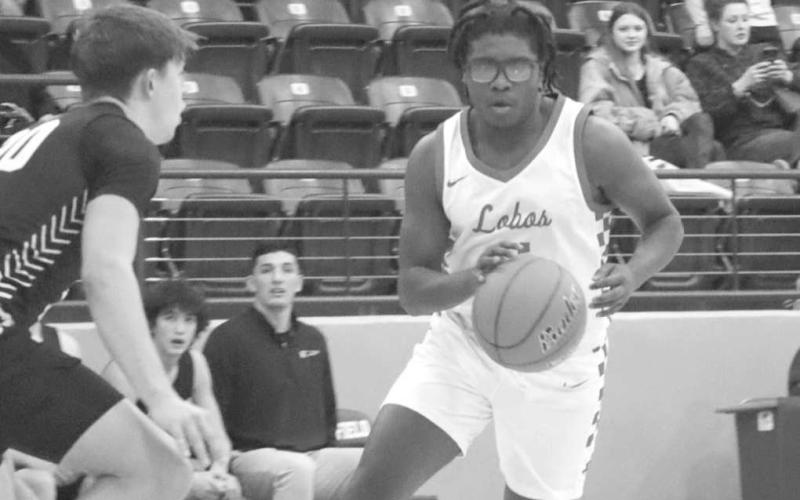 QUICK MOVES - Levelland Lobo Travion Holland brought the ball up court to break the Falcon press defense during the teams contest in the Littlefield Tournament last week. (Staff photo by Aalijah Soliz)
